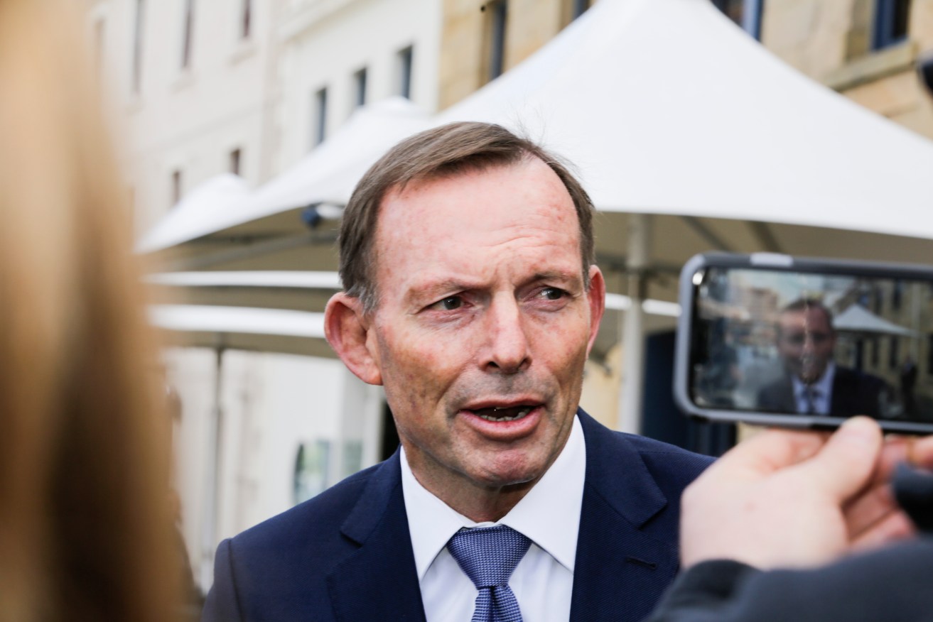 Tony Abbott talks to journalists in Hobart today. Photo: AAP/Jim Rice
