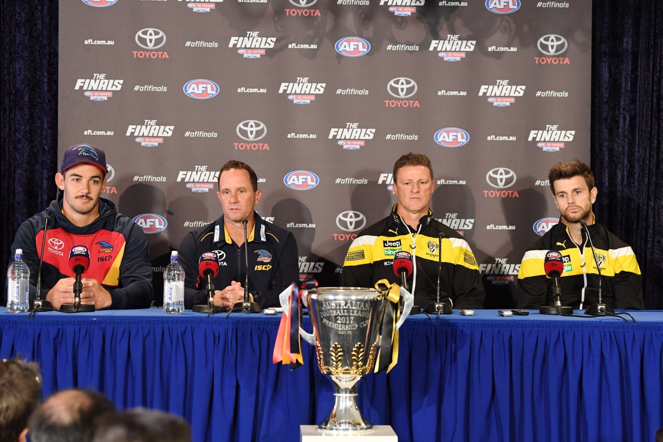 From left: Crows captain Taylor Walker, Adelaide  coach Don Pyke, Richmond coach Damien Hardwick and Tigers captain Trent Cotchin, speak to the media today before the grand final parade.  Photo: AAP/Joe Castro