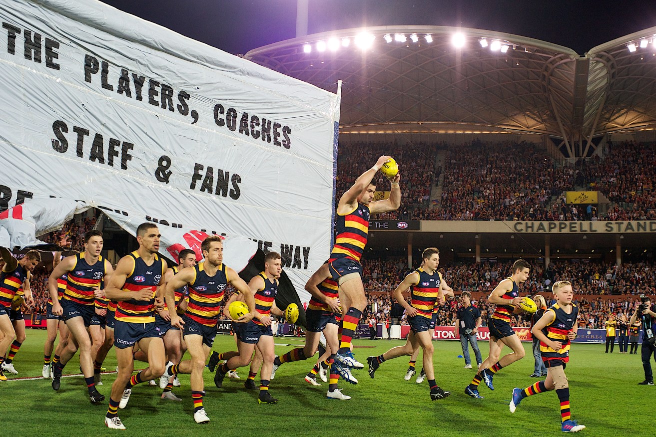 The Adelaide Crows enter Adelaide Oval for Friday's preliminary final. Photo: Michael Errey / InDaily