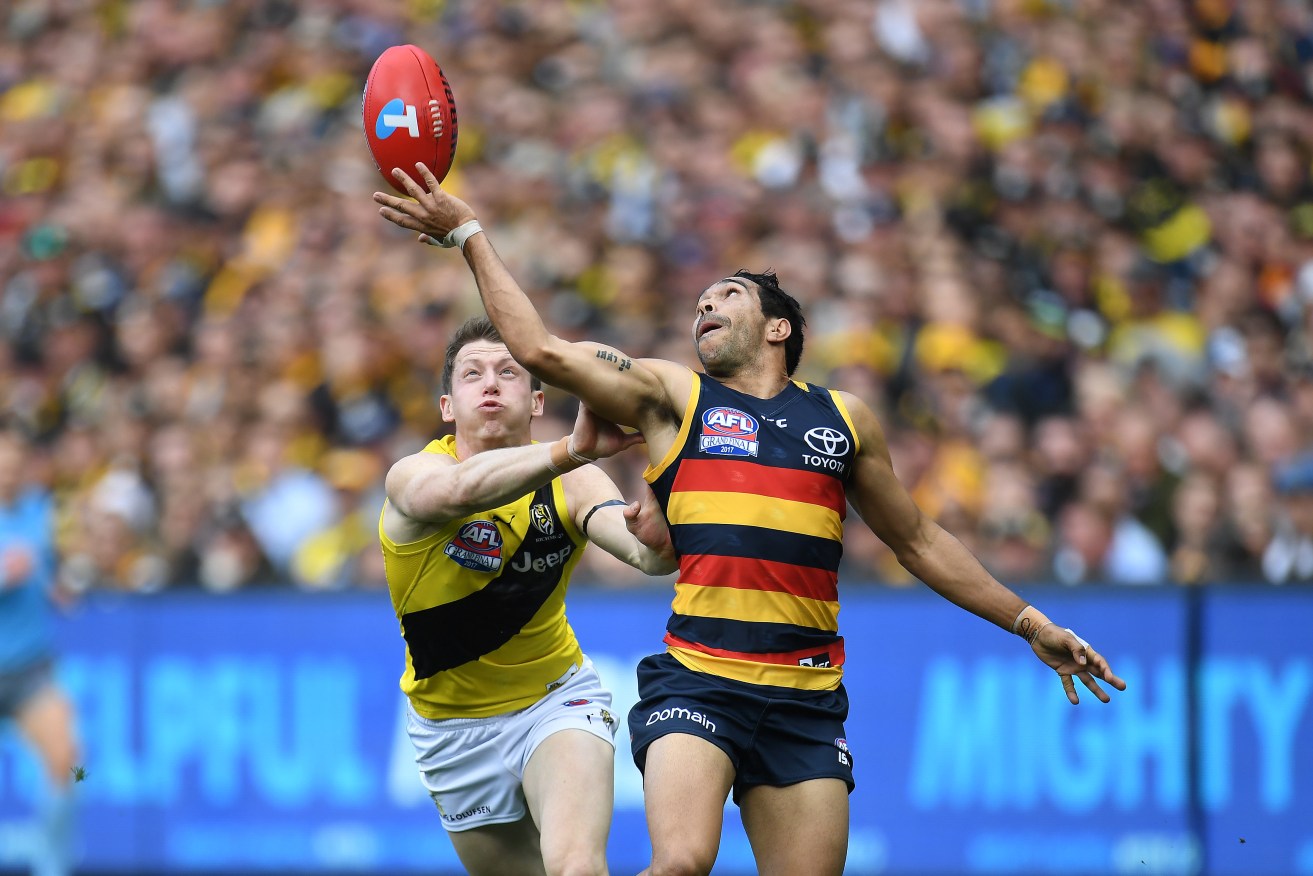 Eddie Betts juggles in front of Dylan Grimes during the 2017 Grand Final. Richmond and the Crows have dominated the AFL's prime-time fixtures in the 2018 draw. Photo: Julian Smith / AAP