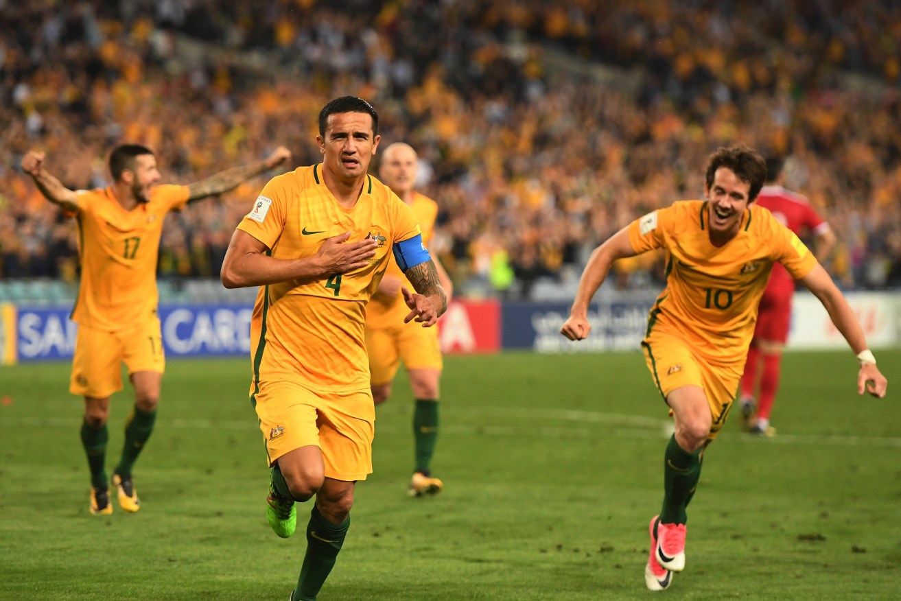 Evergreen Tim Cahill celebrates after scoring in extra time against Syria. Photo: AAP/Dean Lewins