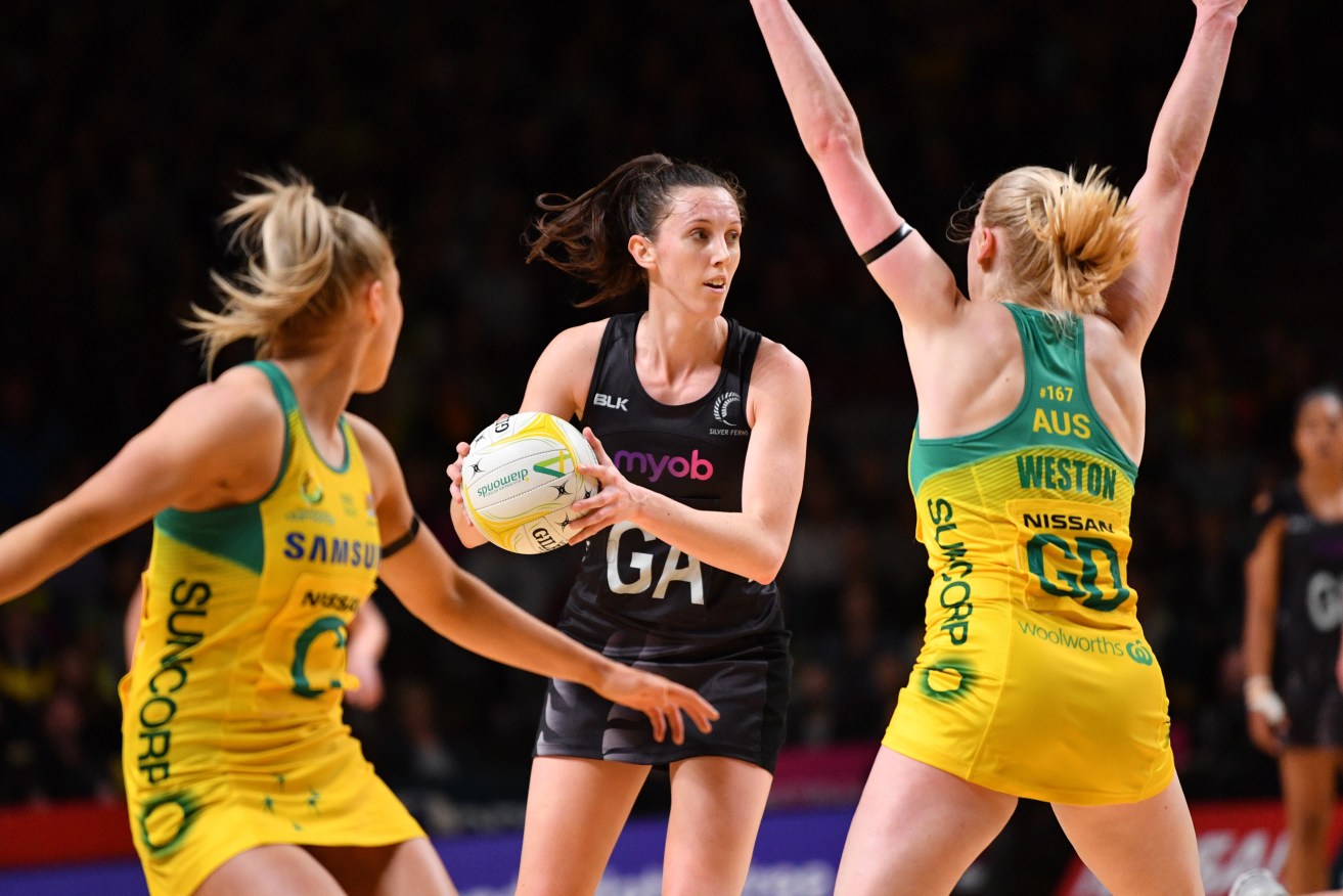 Bailey Mes of New Zealand surrounded by Diamonds during last night's Constellation Cup match in Adelaide. Photo: AAP/David Mariuz