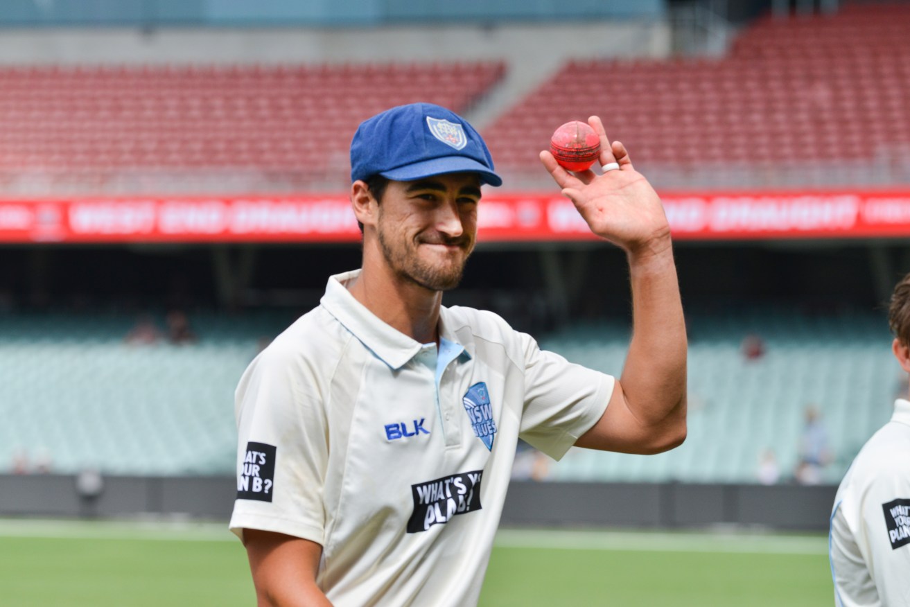 Mitchell Starc acknowledges the crowd after taking eight wickets for 73 runs against SA in the JLT Sheffield Shield day-nighter at Adelaide Oval. Photo: Brenton Edwards / AAP