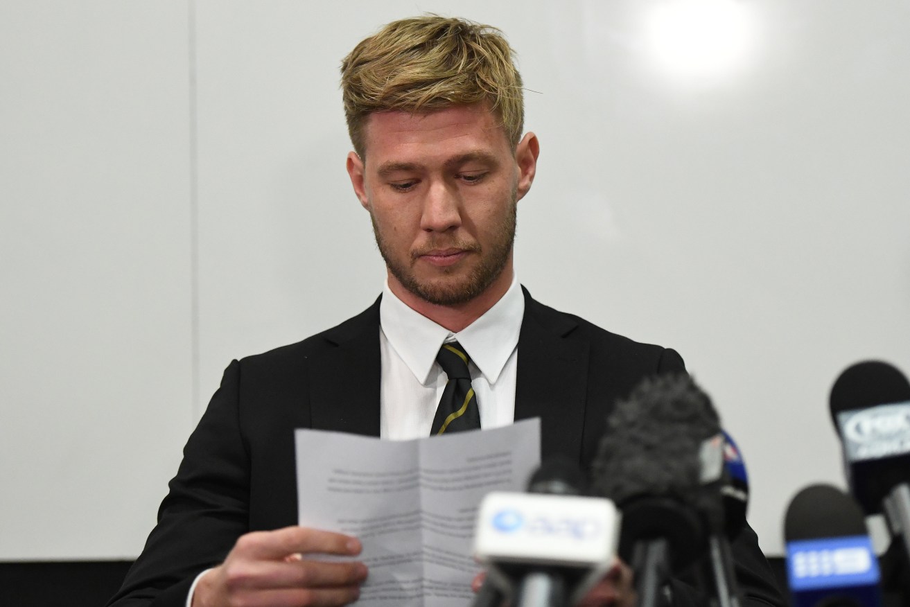 Richmond player Nathan Broad reads from a prepared statement this morning. Photo: Julian Smith / AAP