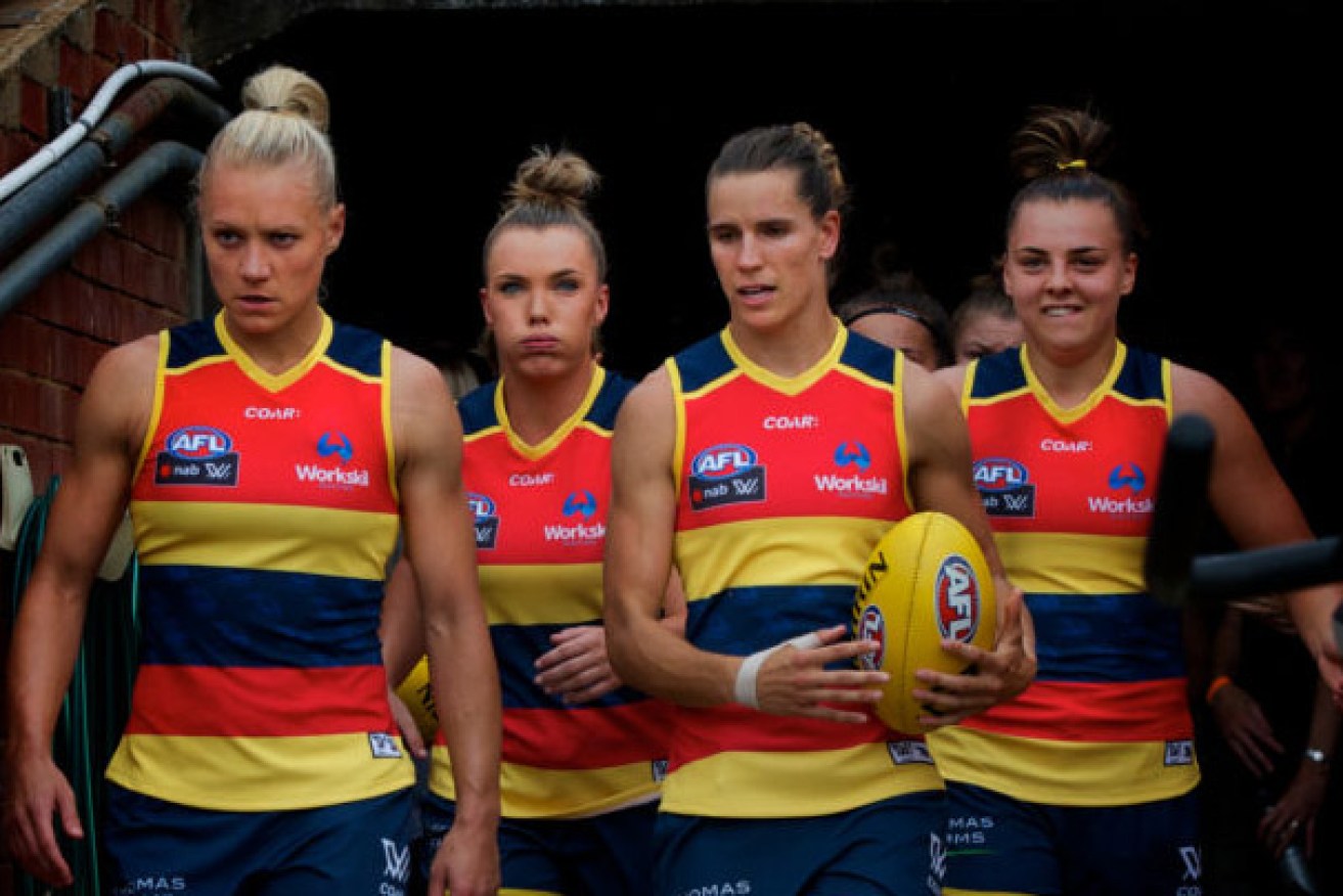Co-captains Erin Phillips and Chelsea Randall lead the Crows' AFLW team out for their Round One match against GWS this year. Photo: Michael Errey / InDaily