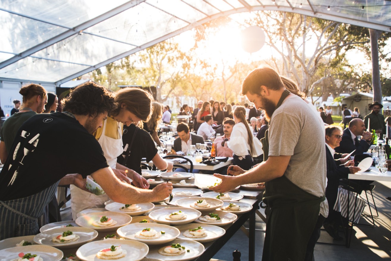 Chefs plate up for the alfresco Ferment the Dinner in Rundle Park. Photo: Duy Dash