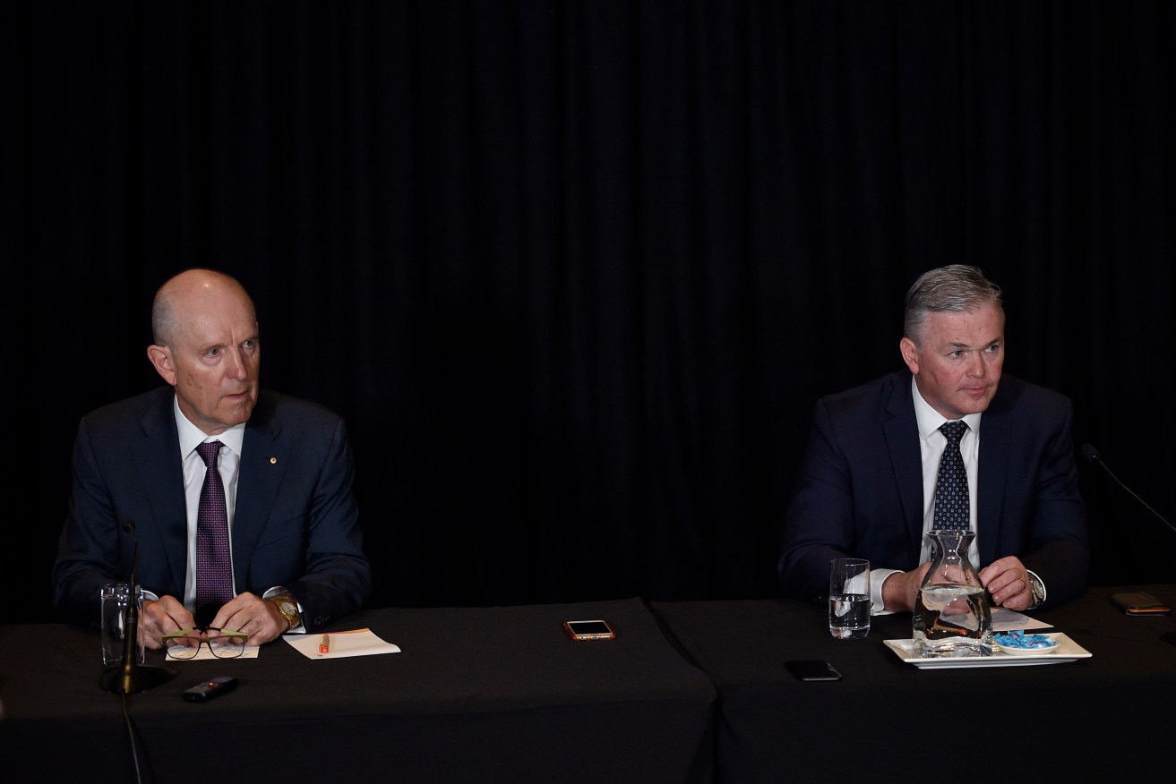 Santos chairman Peter Coates (left) and CEO Kevin Gallagher at this year's AGM in Adelaide. Photo: AAP/David Mariuz