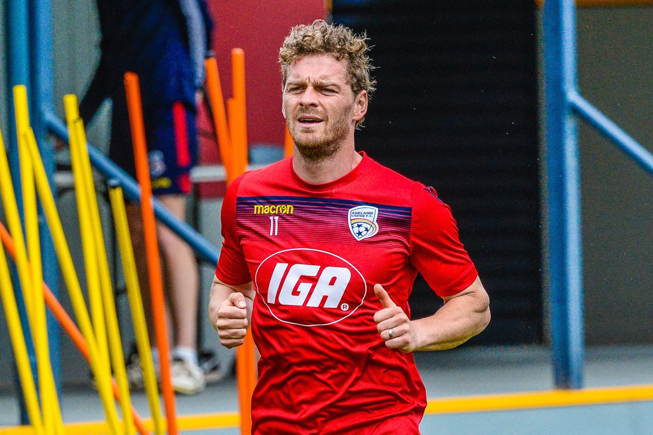 United’s Danish star Johan Absalonsen looks set to return to the Reds’ line up for tomorrow night’s FFA Cup final. Photo: Roy Vandervegt / AAP