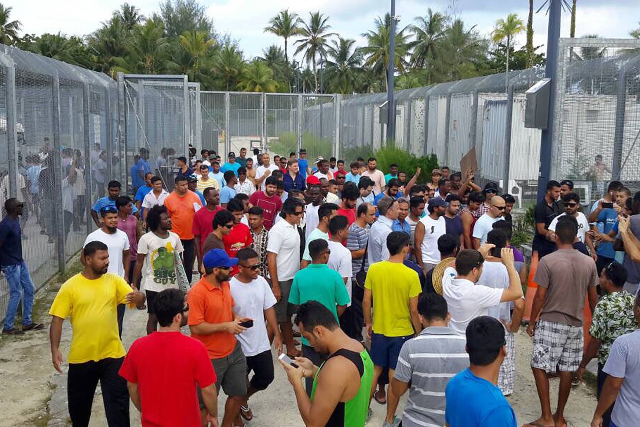 Asylum seekers refusing to leave the Manus Island Detention Centre on Tuesday. Photo: AAP/Supplied by Srirangan