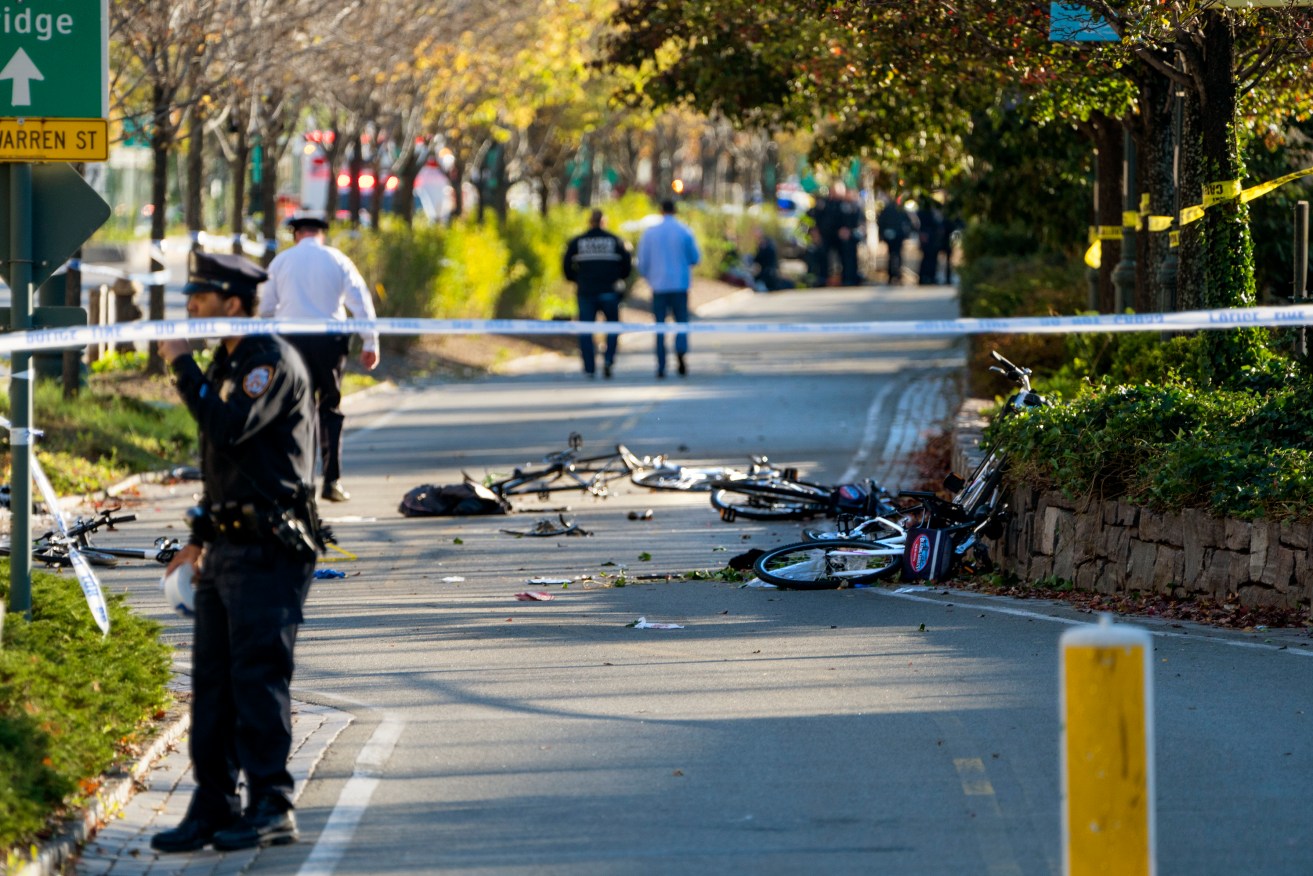 Bicycles and debris lay on a bike path after a motorist drove onto the path near the World Trade Center memorial, striking and killing several people. Photo: AP/Craig Ruttle
