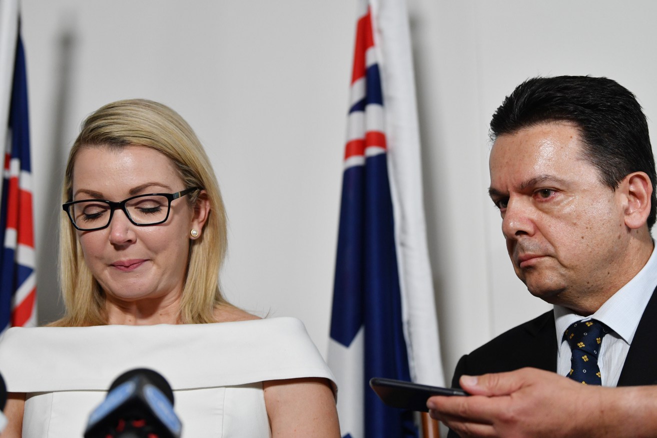 Skye Kakoschke-Moore is overwhelmed as she faces media, flanked by party leader Nick Xenophon. Photo: David Mariuz / AAP