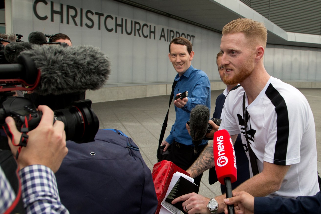 New Zealand-born England cricket star Ben Stokes faces a media scrum after touching down in Christchurch. Photo: Mark Baker / AP