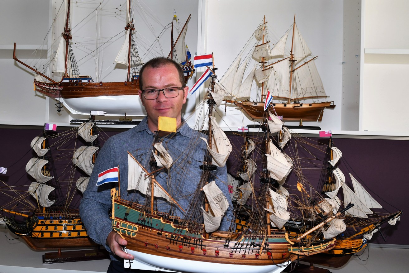 John McCarthy with a model replica of the Batavia, which sank off the WA coast and infamously led to starvation and suspected murder death of dozens of survivors.