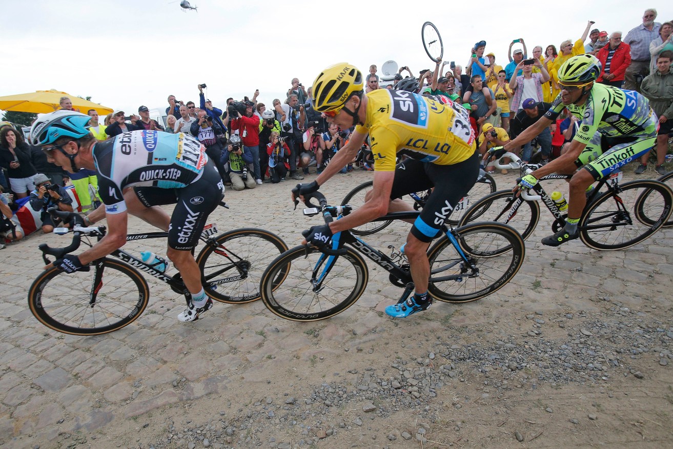 Germany's Tony Martin, left, rides in front of Chris Froome at the 2015 Tour de France. Photo: Christophe Ena / AP