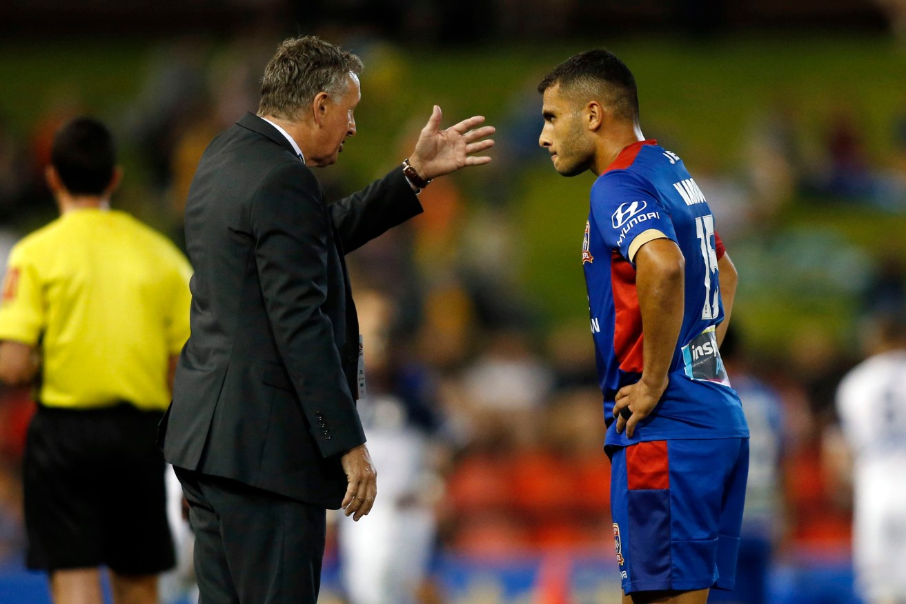 Newcastle Jets coach Ernie Merrick gives instructions to Andrew Nabbout. Photo: Darren Pateman / AAP