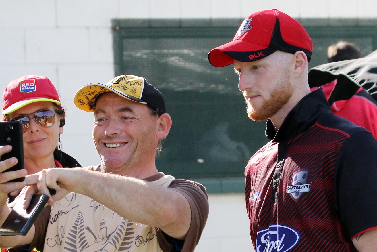 A New Zealand cricket fan takes a selfie with Ben Stokes. Photo: Sanka Vidanagama / AAP