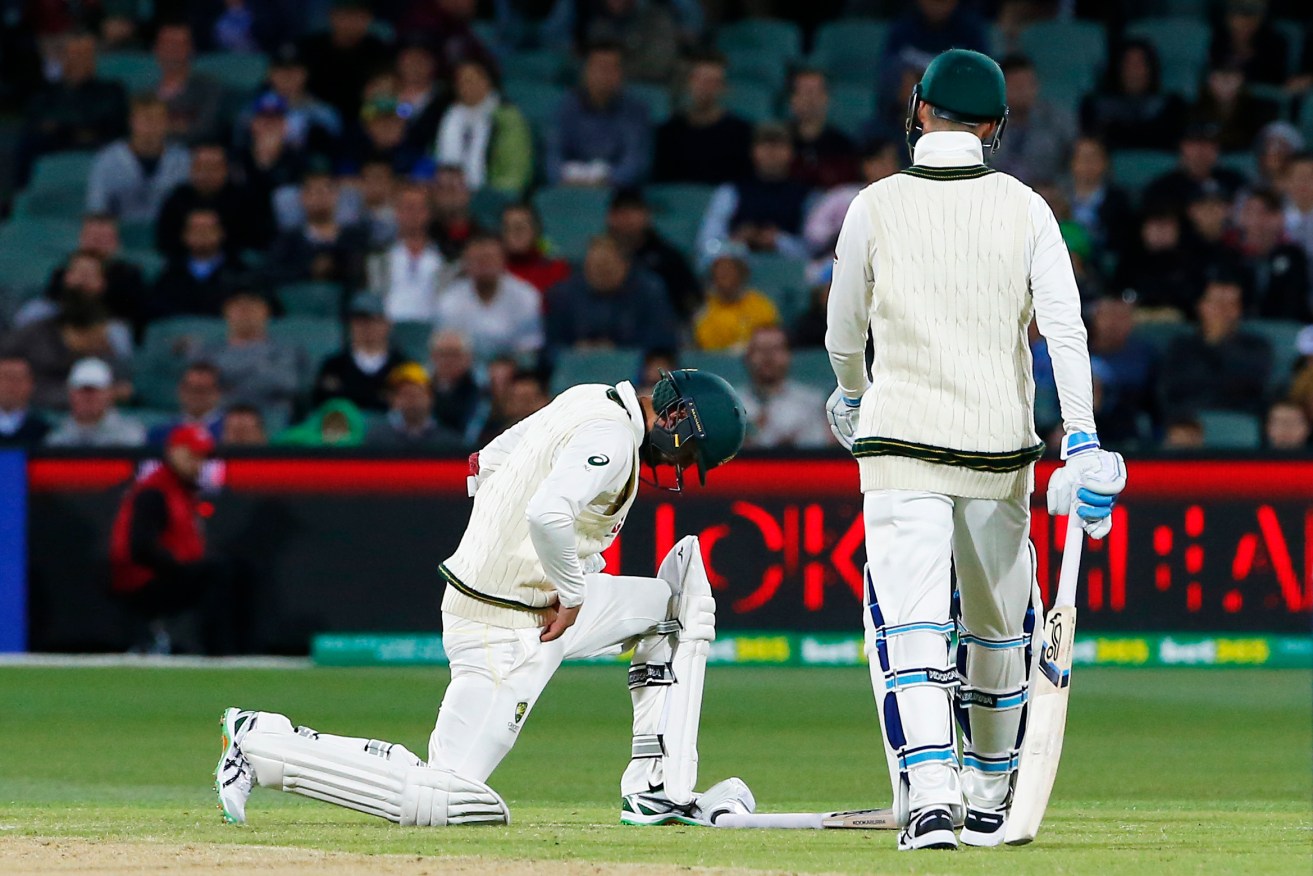 Nathan Lyon goes down after being struck in the last over of day three at the Oval. Photo: Jason O'Brien / PA Wire