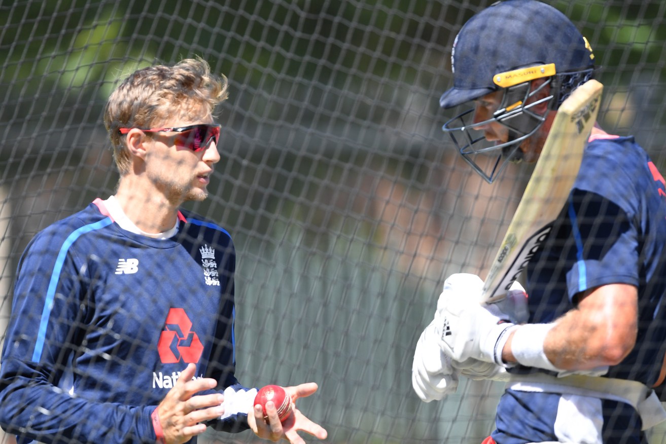 Joe Root chats with Stuart Broad in the nets yesterday. Photo: Dean Lewins / AAP