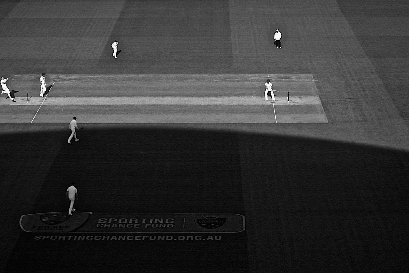 The grandstand casts a shadow over the day's play. Photo: Michael Errey / InDaily