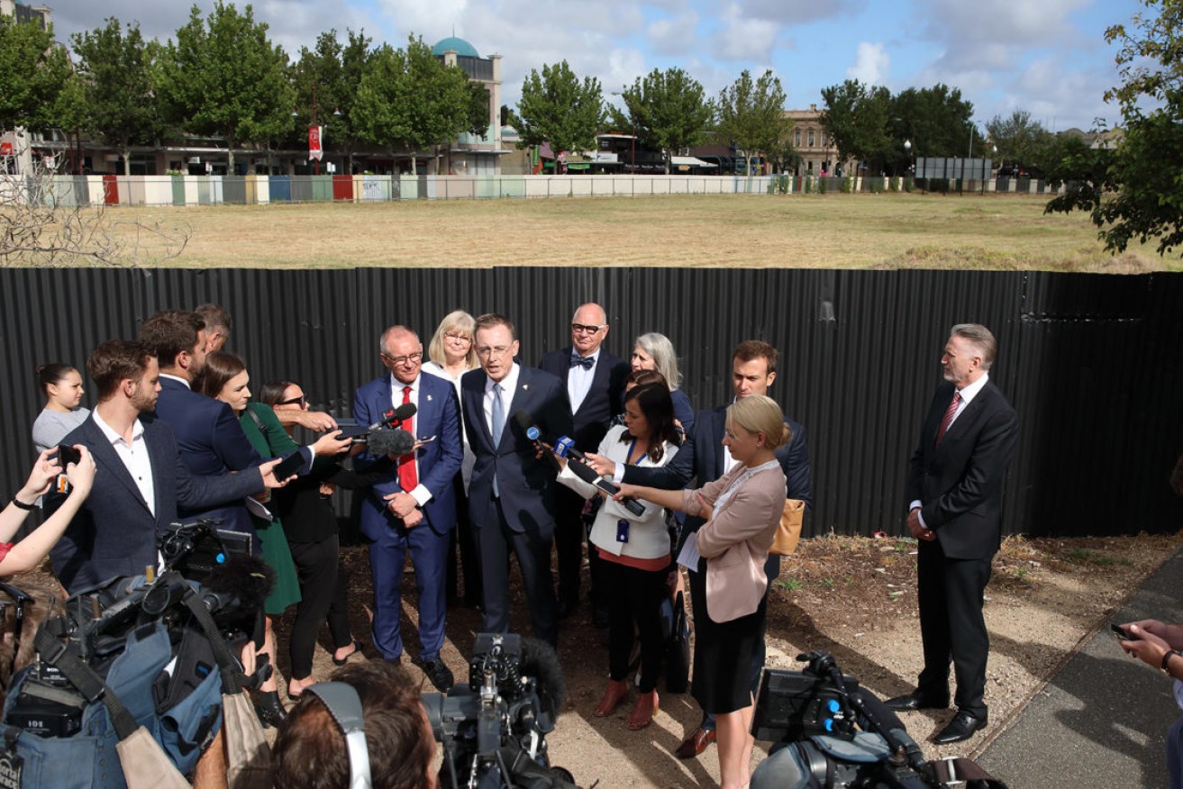 Lord Mayor Martin Haese (centre) announcing the sale of the long-vacant former Le Cornu site in December 2017, flanked by then-Premier Jay Weatherill (left) and city councillors. Photo: Tony Lewis / InDaily