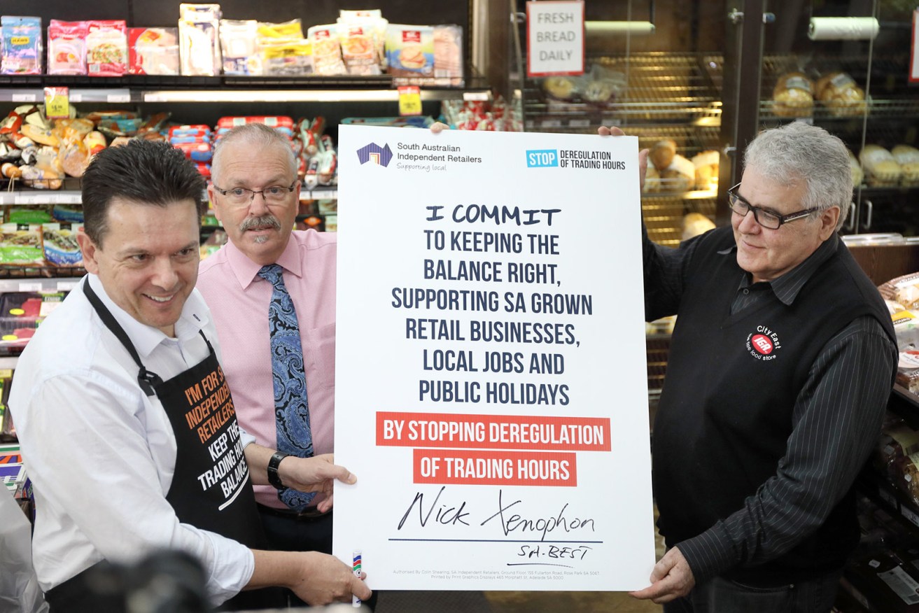 Xenophon signs the pledge against further deregulation of shop trading hours. Photo: Tony Lewis / InDaily