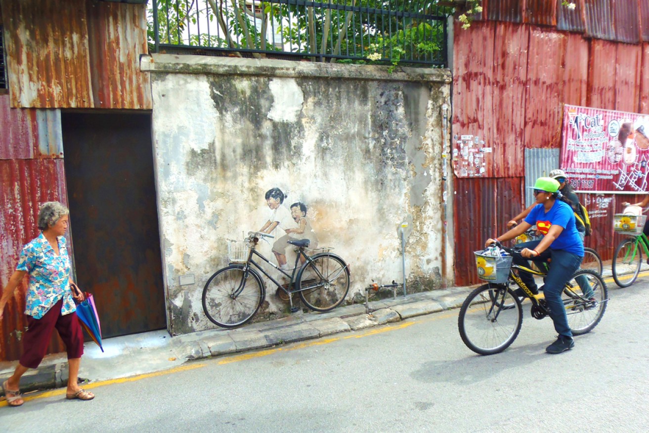 You can hire bikes to explore George Town's street art. Photo: Sonia / flickr