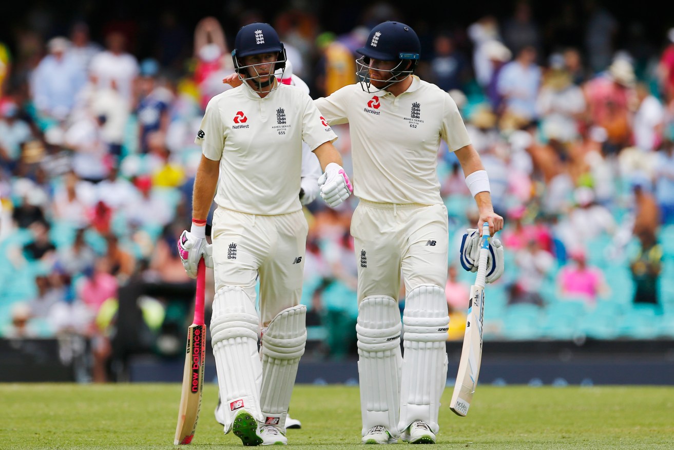 Joe Root and Jonny Bairstow walk off the SCG at lunch. Photo: Jason O'Brien / PA Wire