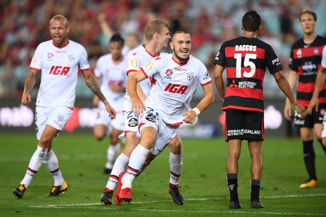 Adelaide's Apostolos Stamatelopoulos celebrates scoring an equaliser against Western Sydney Wanderers. Photo: David Moir / AAP