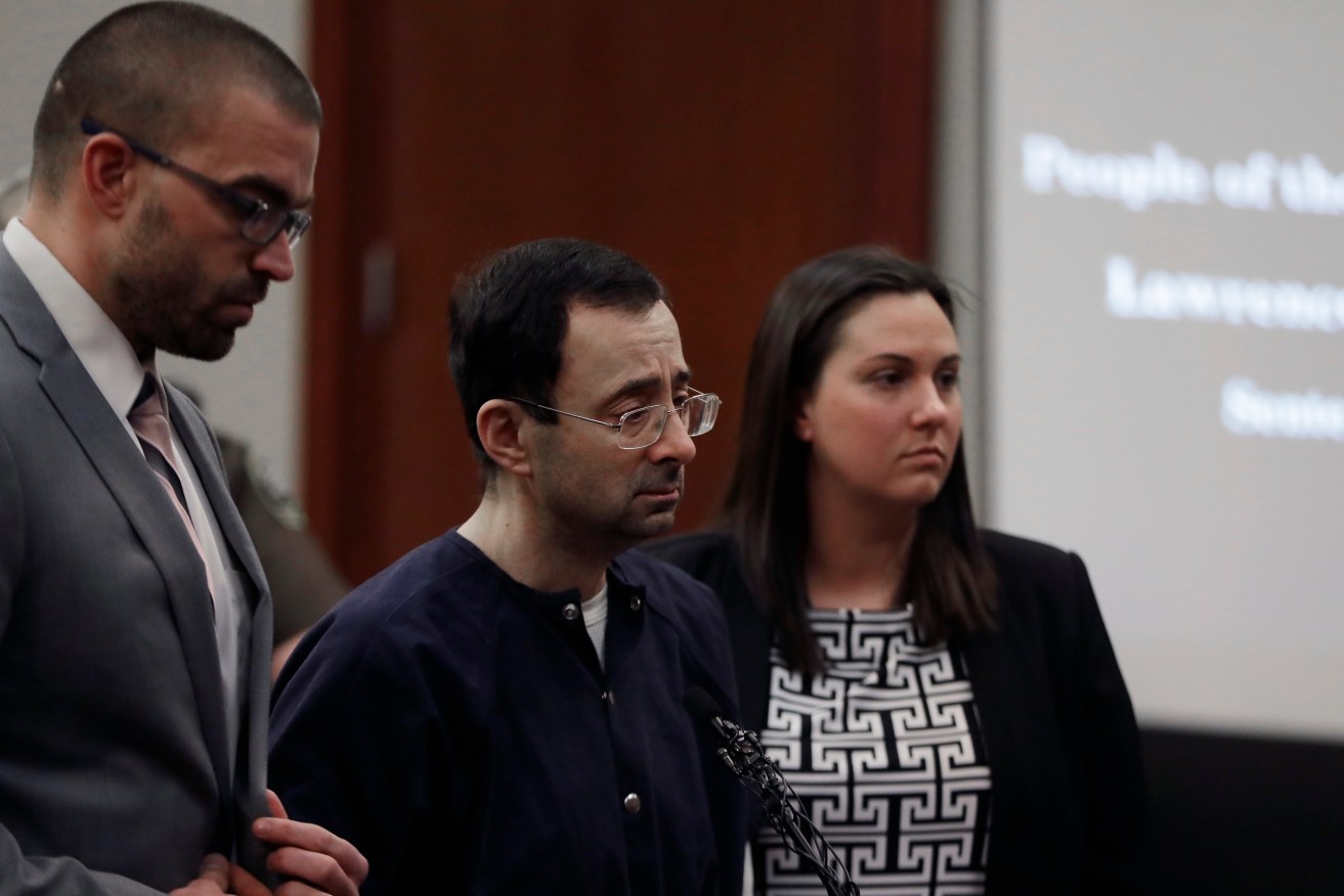 Larry Nassar with attorneys Matt Newburg (left) and, Shannon Smith during his sentencing hearing. Photo: AP/Carlos Osorio