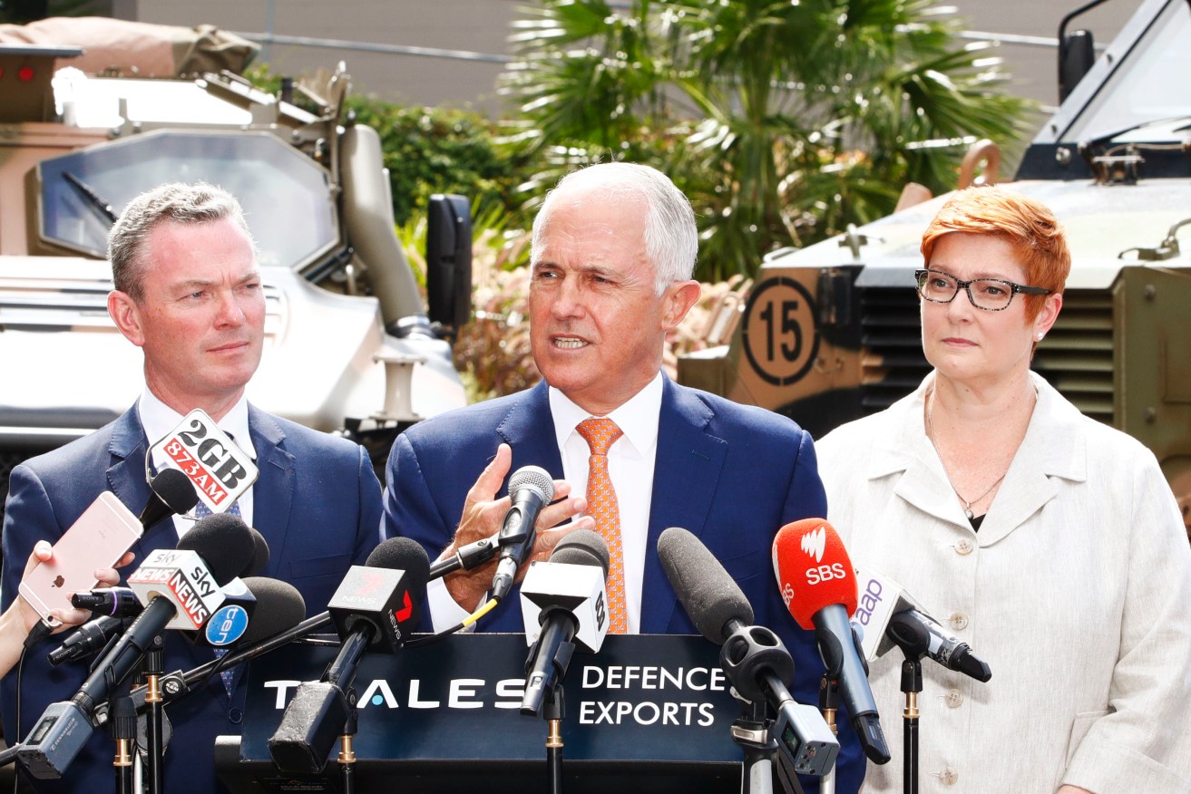 Prime Minister Malcolm Turnbull (centre), flanked by Defence Industry Minister Christopher Pyne and Defence Minister Marise Payne at today's announcement. Photo: AAP/Daniel Munoz