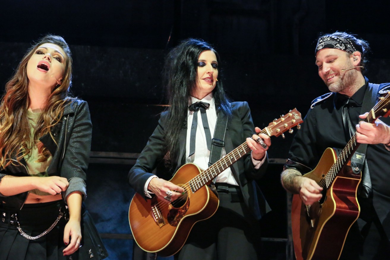 Adalita (centre) owns the stage in Green Day's American Idiot. Photo: Emma Brasier