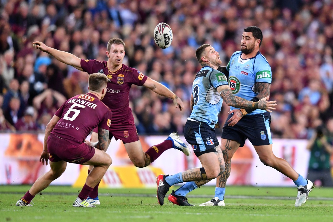 State of Origin attracts a fanatical following and huge television audiences. Photo: AAP/Darren England