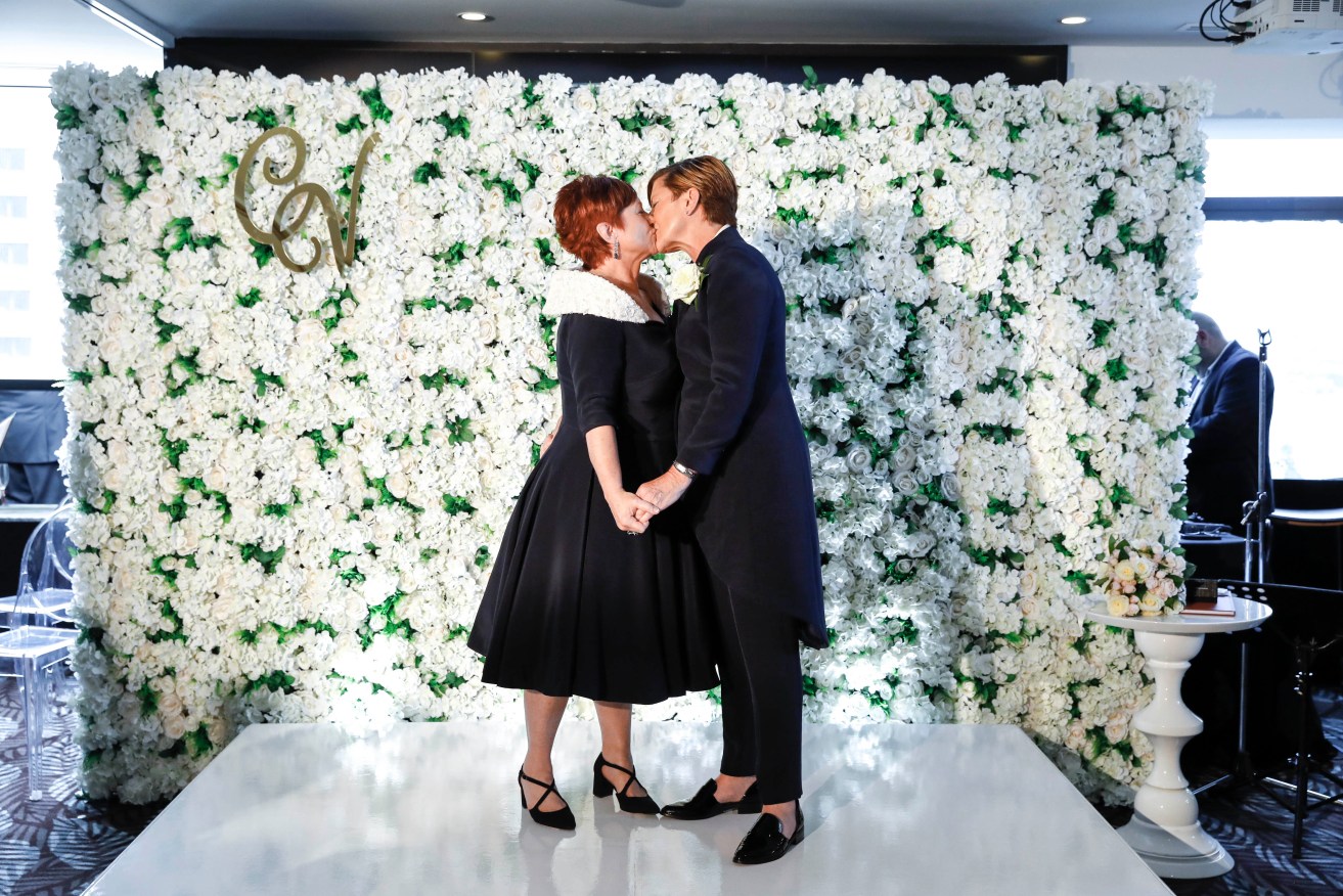Former Prime Minister Tony Abbott's sister Christine Forster (right) and Virginia Edwards were one of 370 same-sex couples to be married so far in Australia. Photo: AAP/ Supplied by @inlightenphotograhy