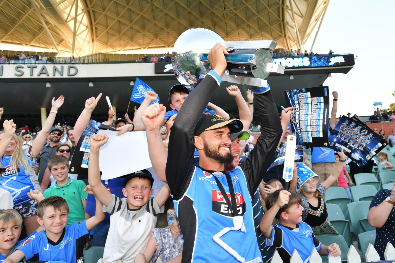 Jake Weatherald celebrates with fans after the Strikers' inaugural BBL title win. Photo: AAP/David Mariuz