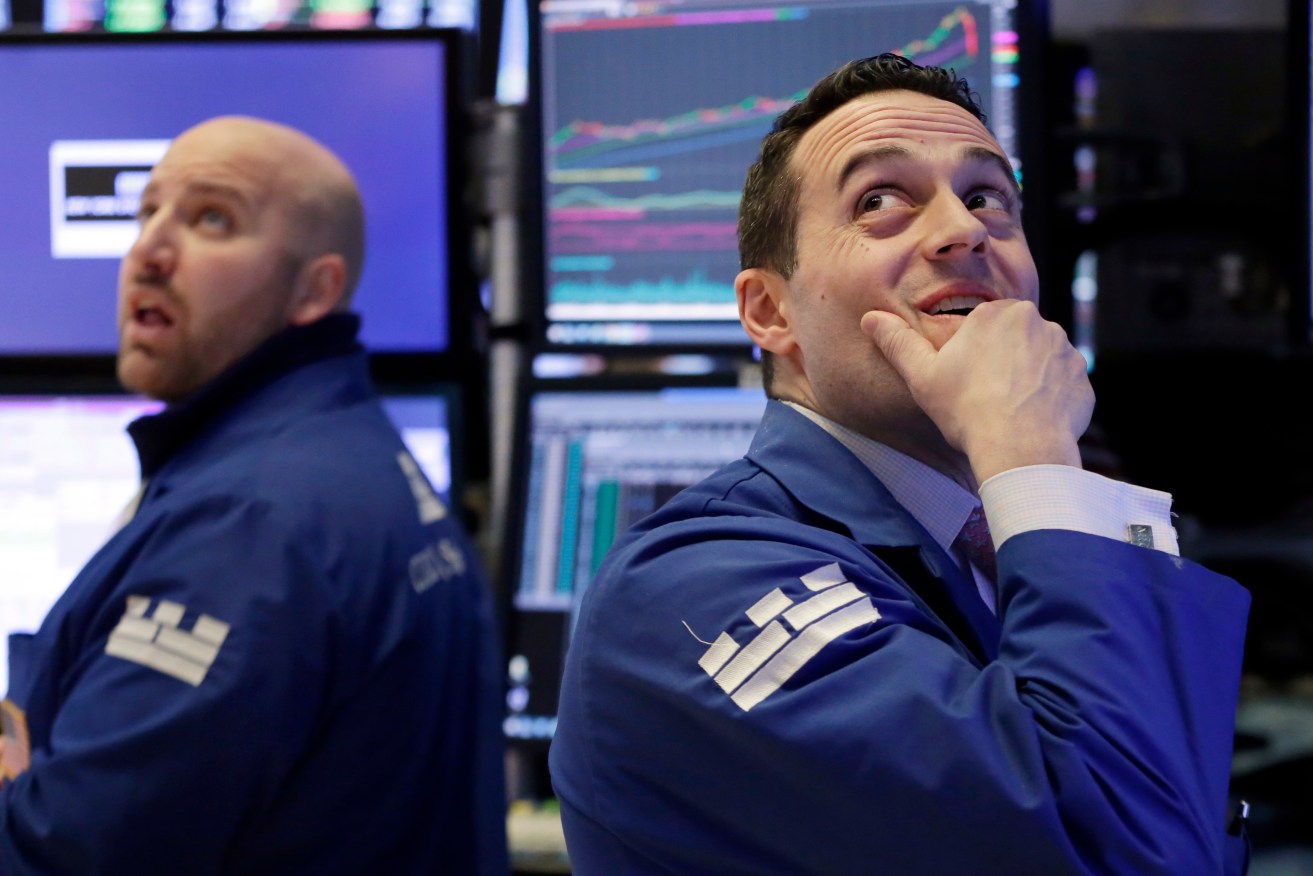 Specialists John Parisi (left) and Michael Gagliano on the floor of the New York Stock Exchange overnight. Photo: Richard Drew/AP