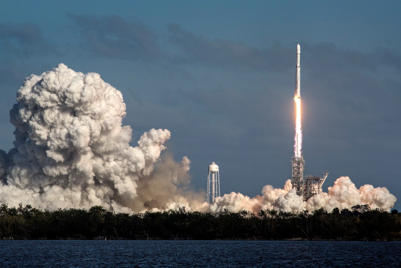 SpaceX’s Falcon Heavy rocket takes off this morning. Photo: EPA/Cristobal Herrera