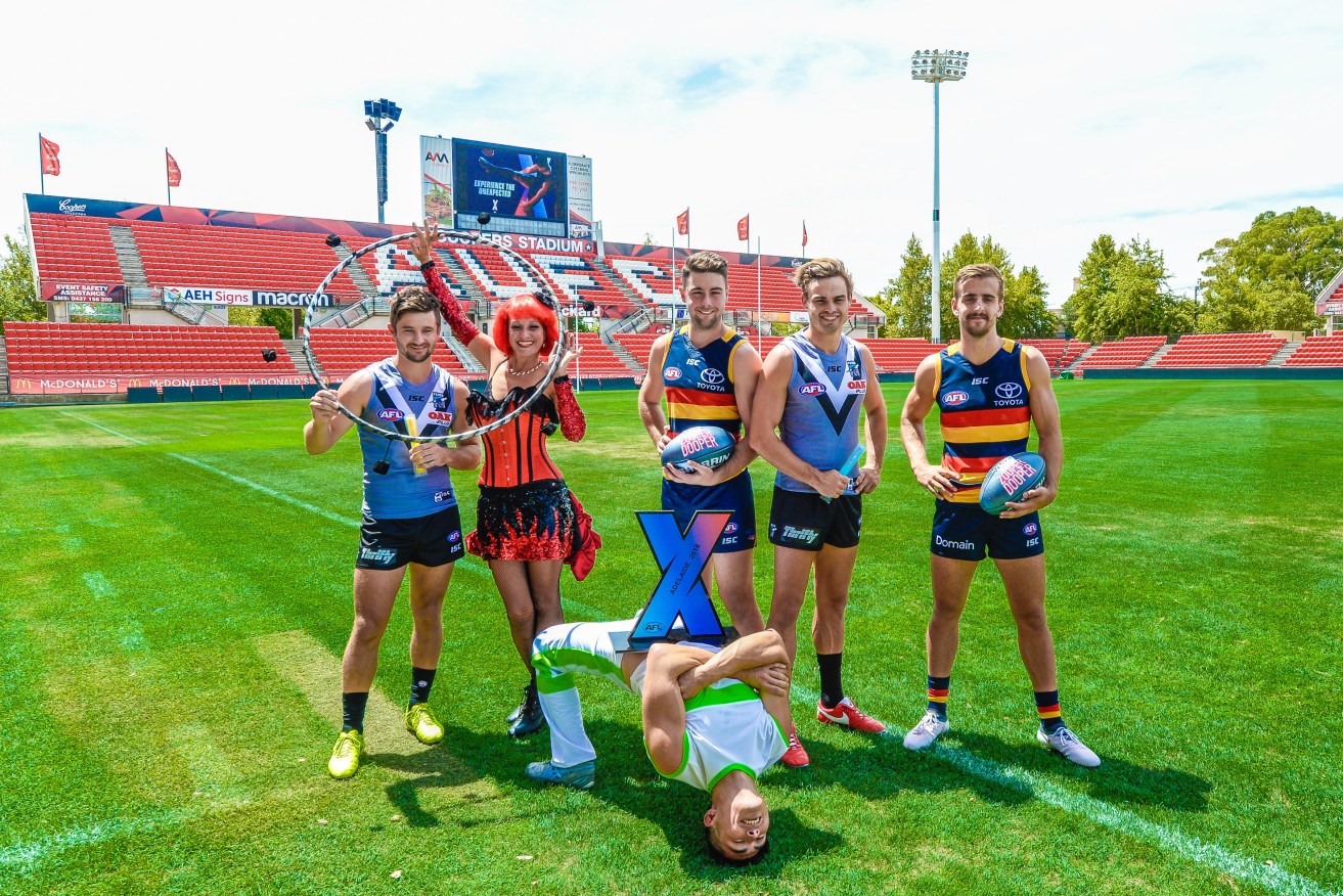 Sam Gray and Karl Amon of Port Adelaide and Jordan Gallucci and Rory Atkins of the Adelaide Crows promote AFLX at Coopers Stadium. Photo: AAP/Roy Vandervegt