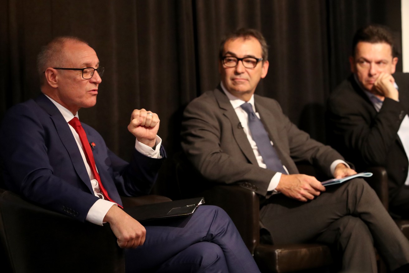Premier Jay Weatherill, Liberal leader Steven Marshall and SA Best leader Nick Xenophon at the SACOSS debate today. Photo: AAP/Kelly Barnes