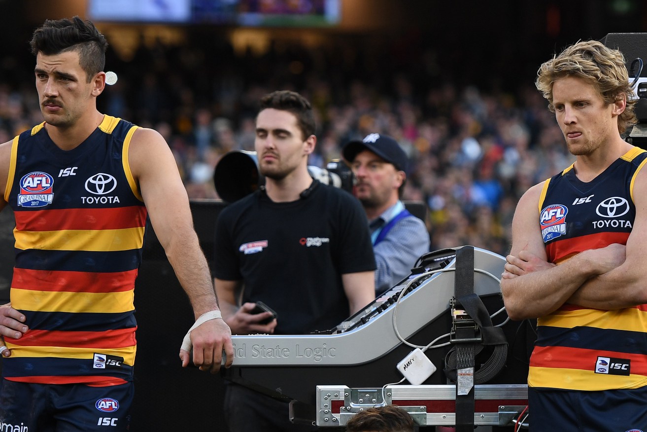Taylor Walker (left) with teammate Rory Sloane of  after losing the AFL grand final. Photo: AAP/Julian Smith