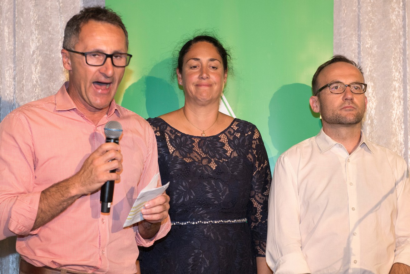 Greens leader Richard Di Natale, Greens candidate for Batman Alex Bhathal (centre) and Greens deputy leader Adam Bandt concede defeat. Photo: AAP/Ellen Smith