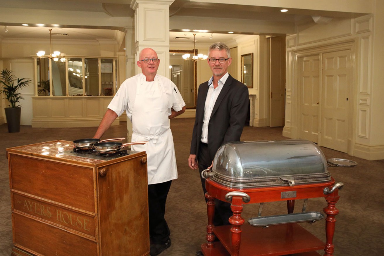 Ayers House executive chef Paul Groves and director Richard McLeod with two of the gueridons in the Henry Ayers Room. Photo: Tony Lewis / InDaily