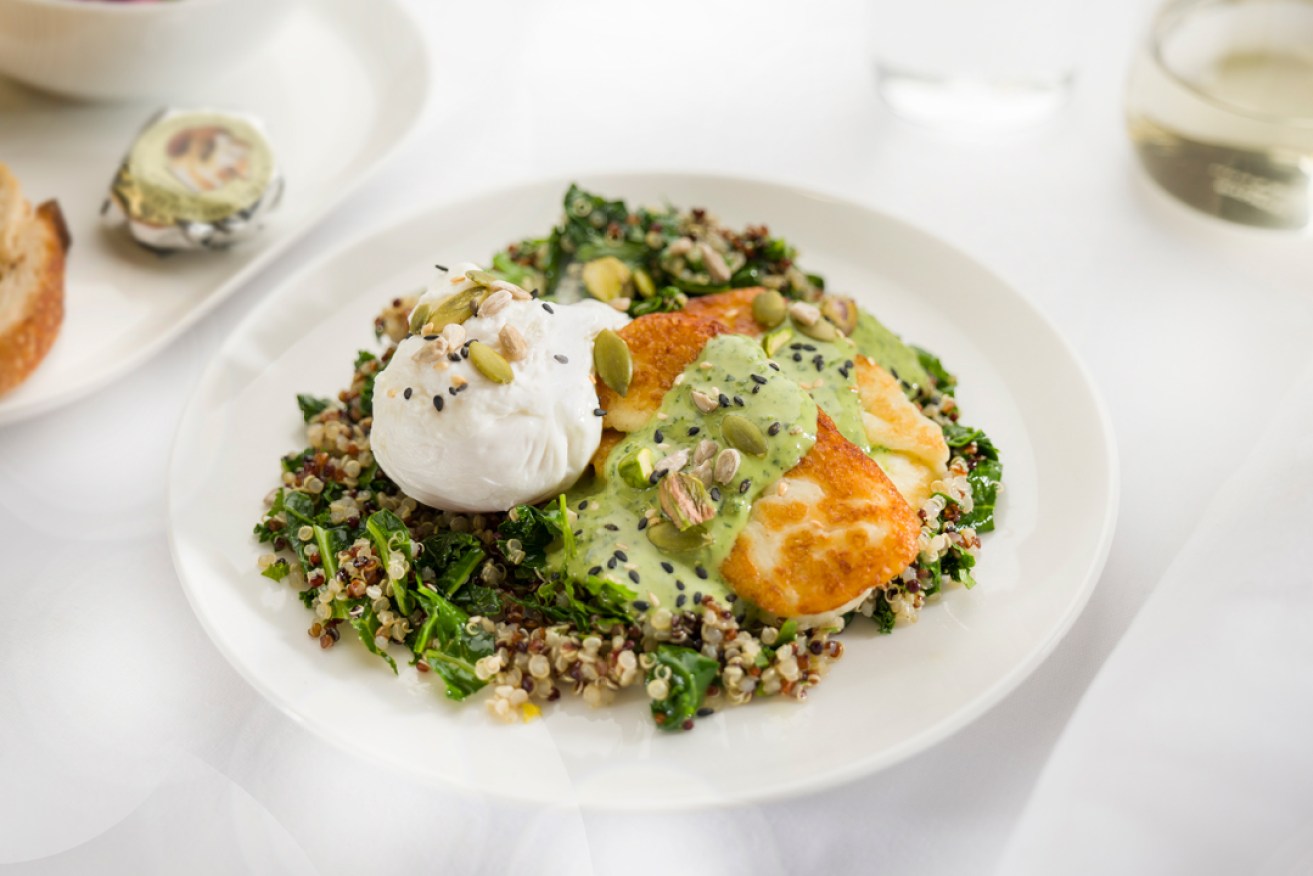 Poached eggs with kale, quinoa and grilled haloumi - one of the new meals Qantas is trialling. Photo: AAP