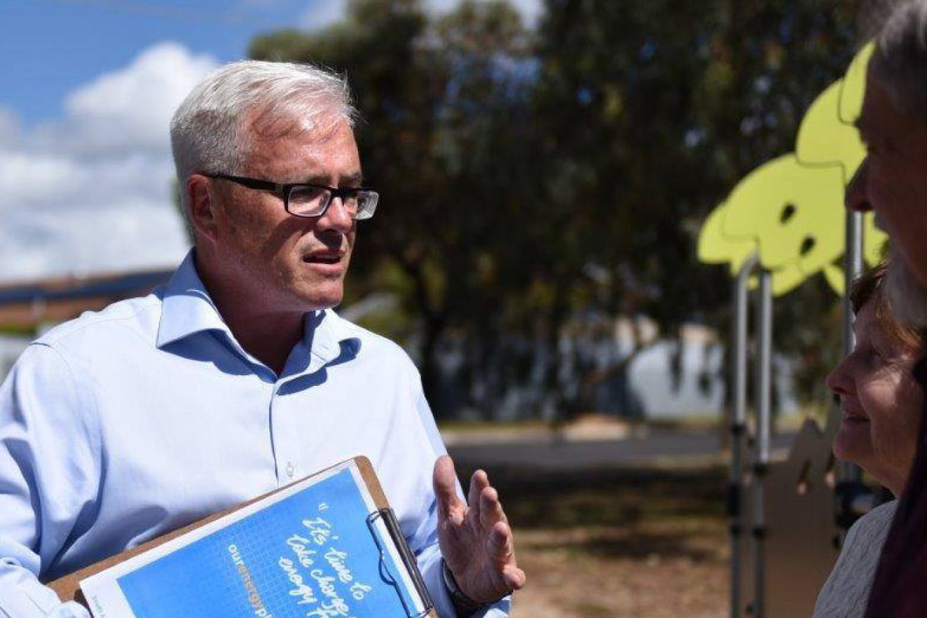 Rik Morris, here campaigning for the state seat of Florey, has been sacked from the Premier's Department. Photo: Facebook