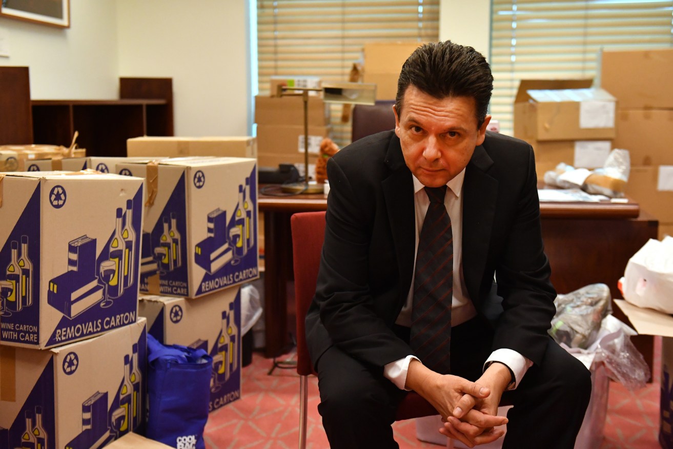 Nick Xenophon packing up his Senate office boxes last year ahead of his unsuccessful state election tilt. Photo: Mick Tsikas / AAP