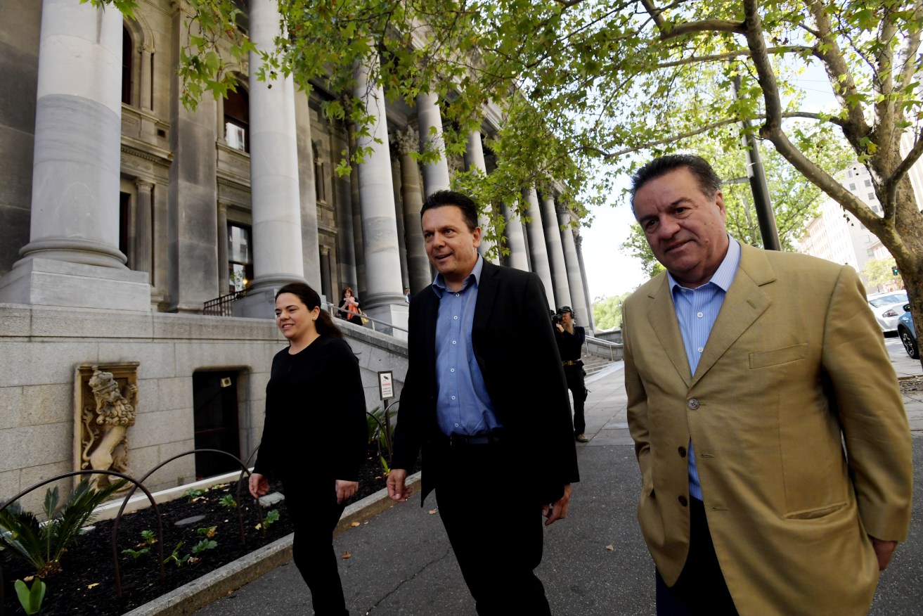 Nick Xenophon with Frank Pangallo (right) and Connie Bonaros (left) after polling day. Photo: AAP