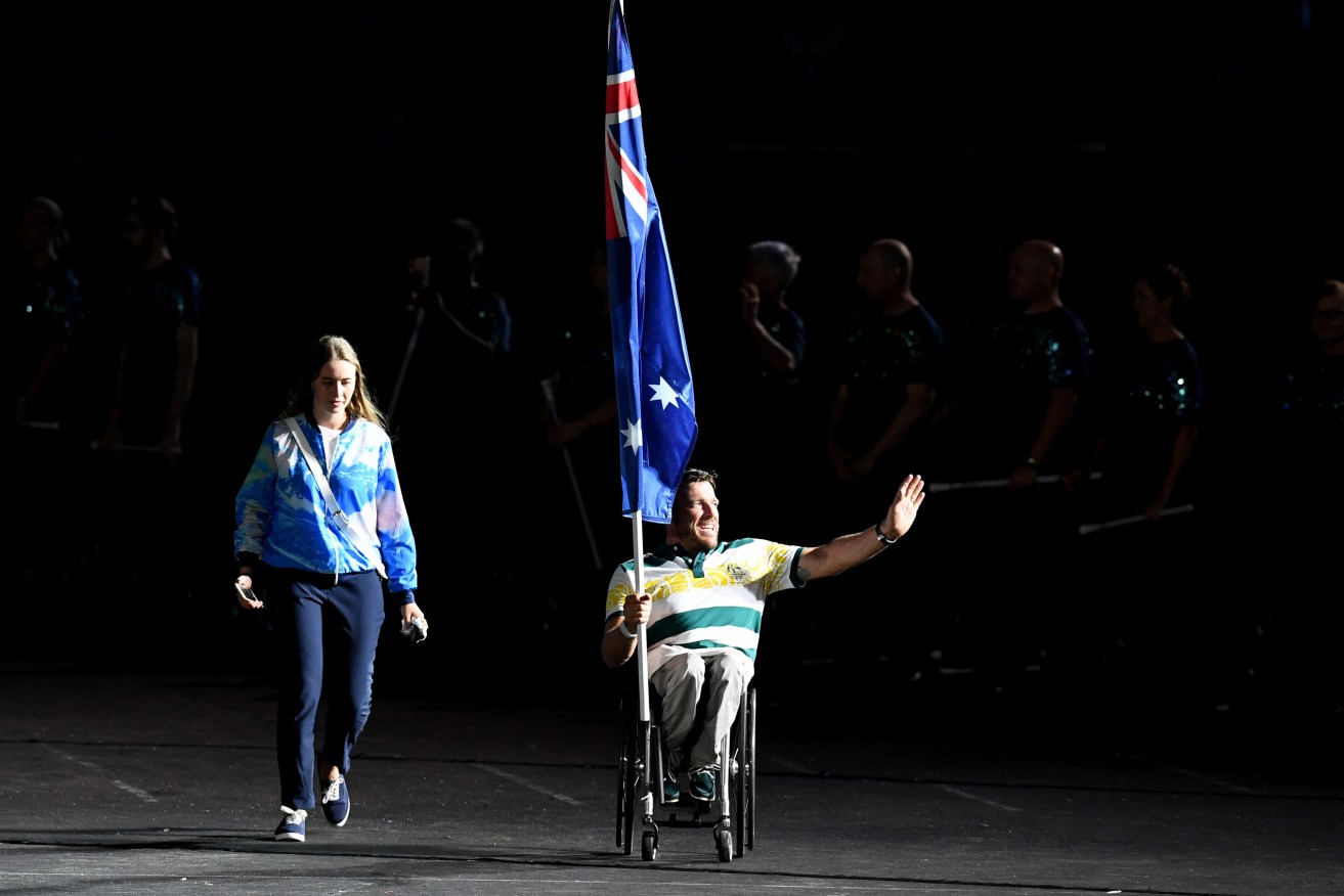TV viewers missed this moment: Australian flagbearer Kurt Fearnley enters the stadium before the start of the closing ceremony. Photo: AAP/Dan Peled