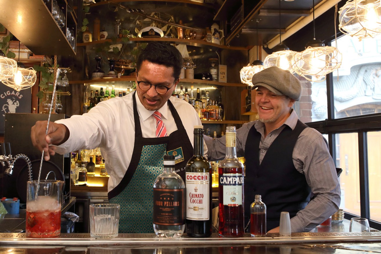 Dilhan C Fernando blends a tea cocktail with Hains & Co owner Marcus Motteram. Photo: Tony Lewis / InDaily