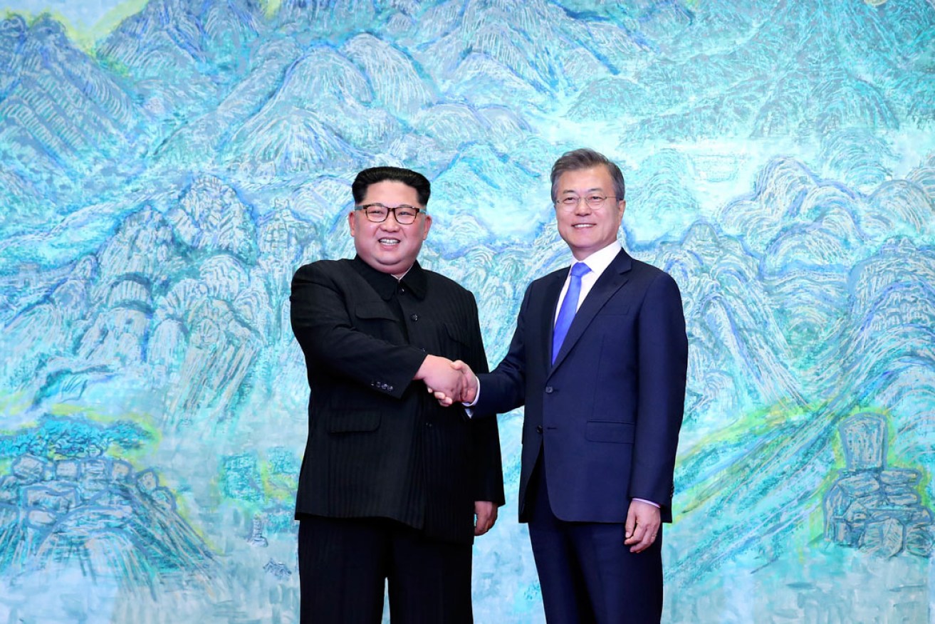 North Korean leader Kim Jong Un shakes hands with South Korean President Moon Jae-in at the Peace House at the border village of Panmunjom in the demilitarised zone. Photo: AP