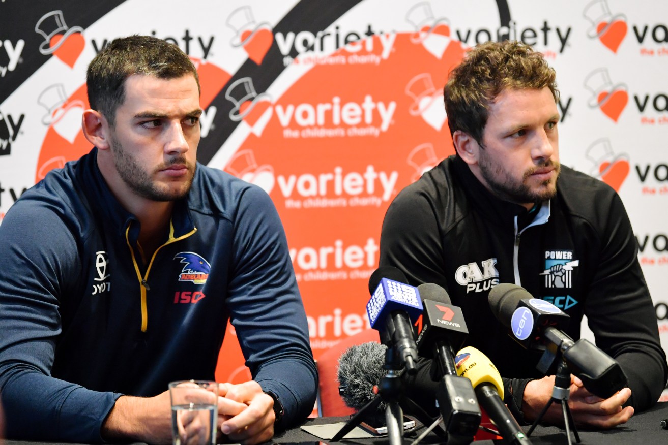 Crows captain Taylor Walker and Port skipper Travis Boak front the media today ahead of the weekend's Showdown. Photo: Morgan Sette / AAP