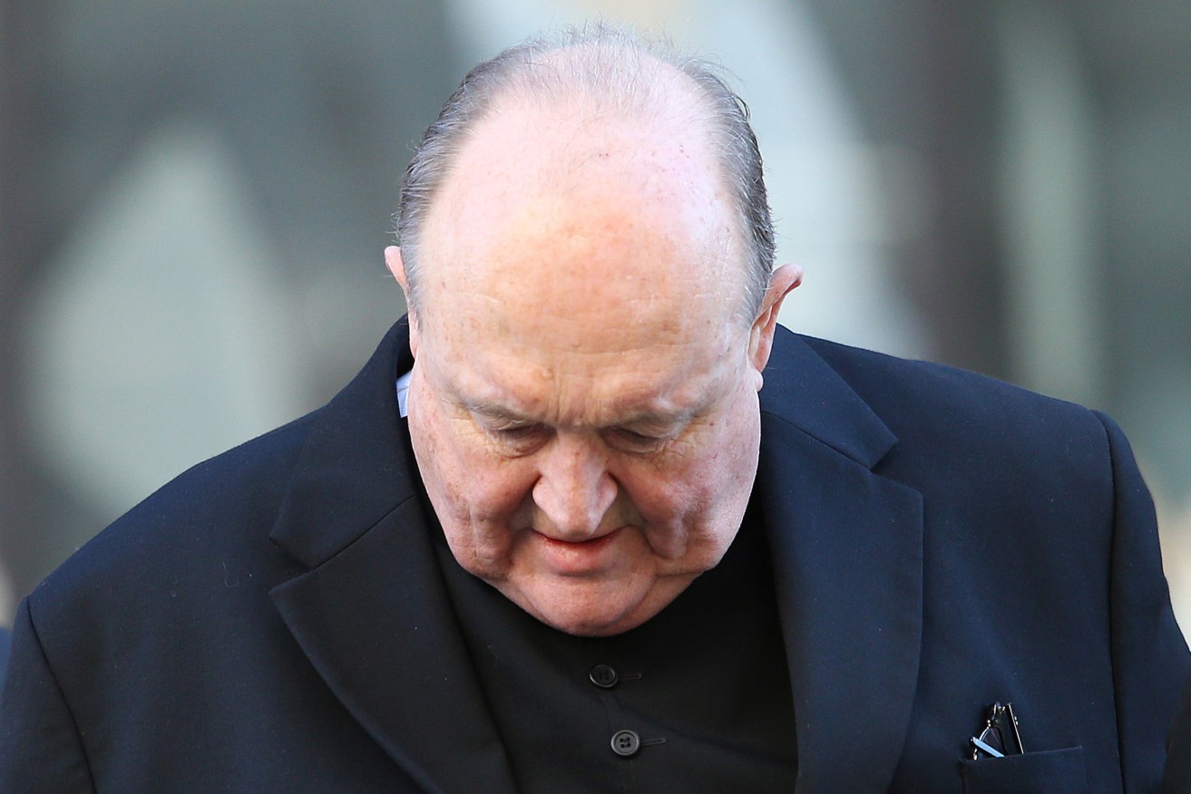 Archbishop Philip Wilson arrives at Newcastle Local Court today. Photo: AAP/Peter Lorimer